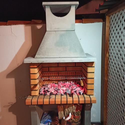 a model of a brick oven with food inside at Casa Ada in Tejeda