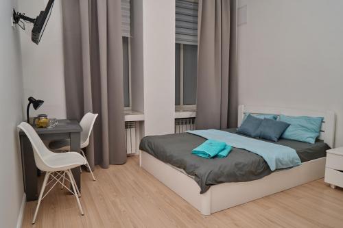 Postel nebo postele na pokoji v ubytování Сentral Apartments