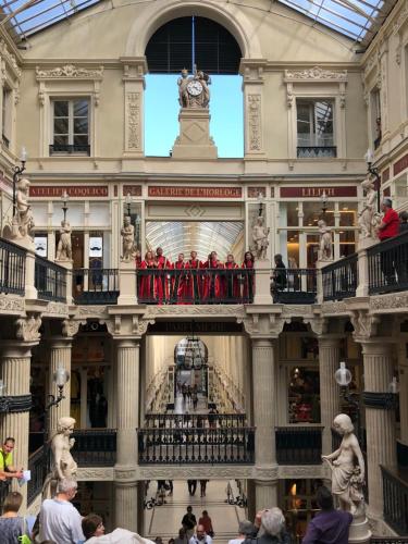 a group of people standing on a balcony in a building at La Maison D'Hôtes Nantes Centre in Nantes