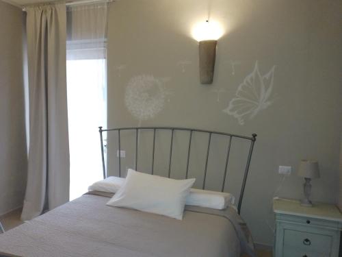 A bed or beds in a room at All'Antica Ruggine