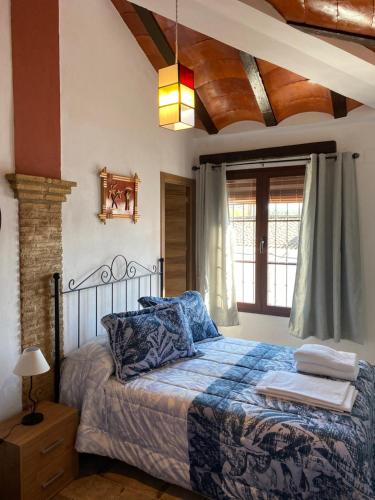 Ліжко або ліжка в номері Casa Asador Sierra De Aracena