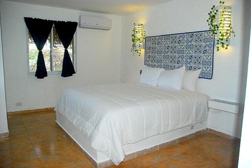 Postel nebo postele na pokoji v ubytování Nuovo Hotel Playa Catalina