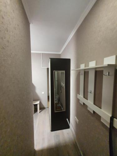 a hallway with a mirror in a room at Гостевой дом на Цюрупы 32,Г2 in Sochi