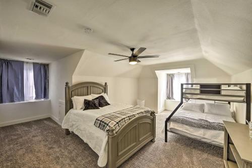 a bedroom with a bed and a ceiling fan at Riverside House with Yard about 1 Mi to Downtown! in Riverside