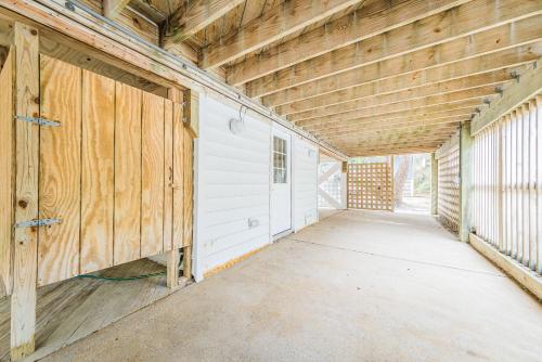 an empty garage in a building with wooden walls at Gone With the Wind in Duck