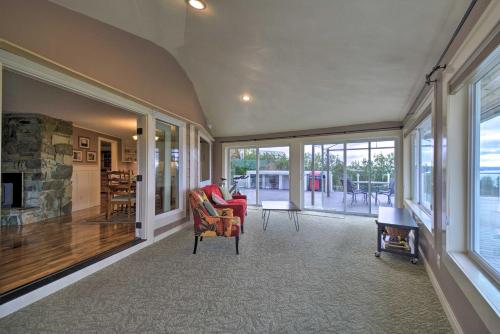 a living room with a couch and a fireplace at Breathtaking Port Ludlow Home with Deck and Yard in Port Ludlow