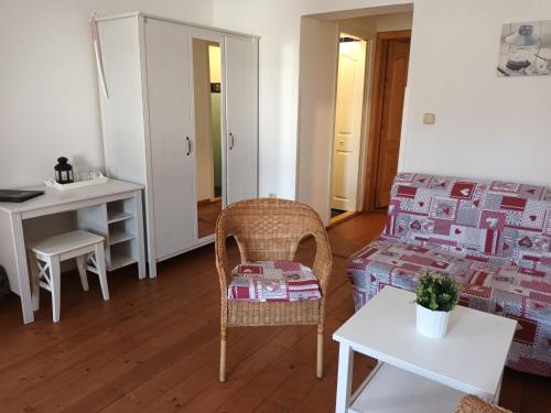 a living room with a couch and a table at Hotel Střelnice in Teplice nad Metují