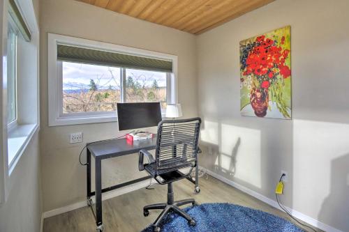 a desk with a computer in a room with a window at Breathtaking Port Ludlow Home with Deck and Yard in Port Ludlow