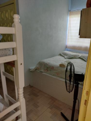 Ένα ή περισσότερα κρεβάτια σε δωμάτιο στο Pousada Shalom