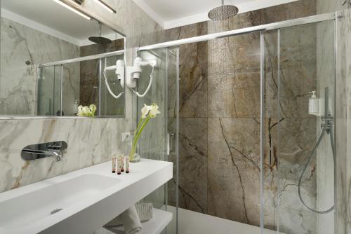 a bathroom with a shower and a sink at Dimora ai Fori - Guest House in Rome