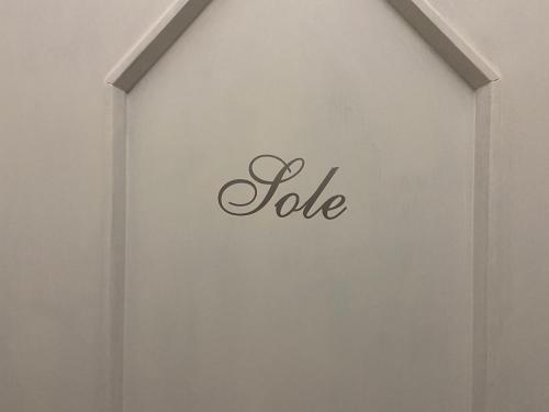 a white wall with the word joke on it at House Villa Anna in Polignano a Mare