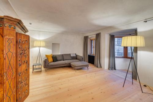 a living room with a couch and a chair at Boutiquehotel Rattenberg in Rattenberg