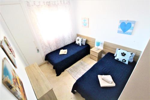 Postel nebo postele na pokoji v ubytování Residence Vacanza Torre Montecarlo