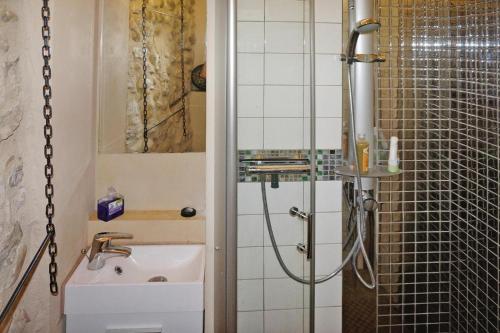 a bathroom with a shower and a sink at Scenic Village Home with Lake Panorama in Sainte-Croix-de-Verdon