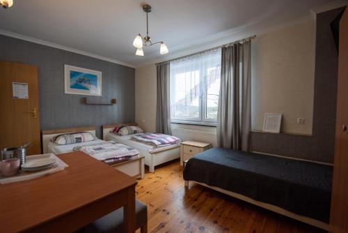 Un pat sau paturi într-o cameră la Skalny Widok