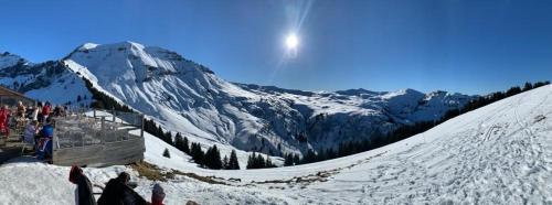 a group of people standing on a snow covered mountain at L'Onyx - Domaine de Nant Cruy in Sallanches