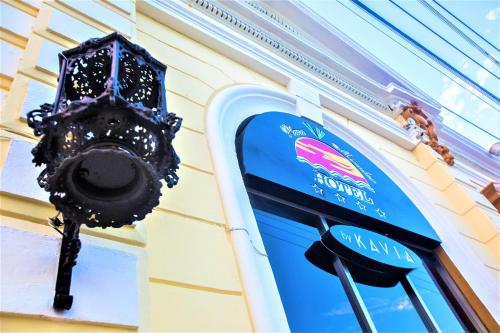 a building with a sign on the side of it at Hotel Plaza Mirador in Mérida