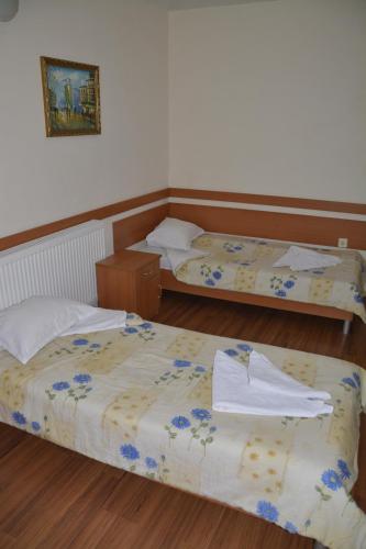 Postel nebo postele na pokoji v ubytování Hotel Wesso