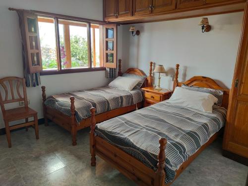 Giường trong phòng chung tại VolKKanrentals Villa Baljat