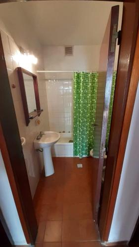 a bathroom with a sink and a toilet and a shower at Departamentos Carlos Paz bajada al lago in Villa Carlos Paz
