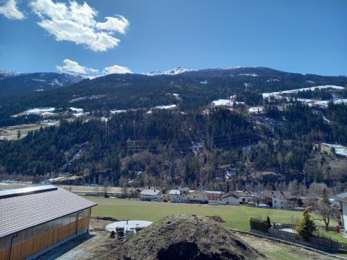 a view of a field and a mountain at Nagelehof 2 in Ainet