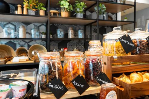a store filled with jars of food on display at Staycity Aparthotels Frankfurt Airport in Frankfurt/Main