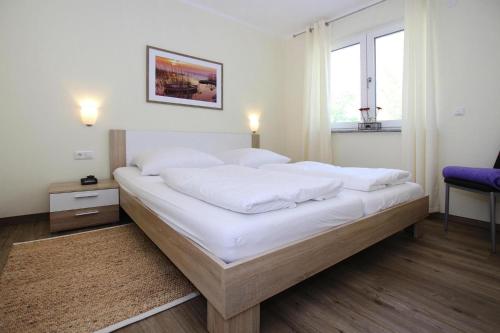 Llit o llits en una habitació de Appartement Hafenflair am Plauer See, Plau am See