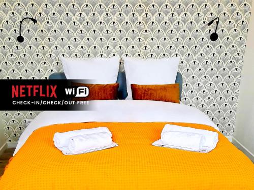 Een bed of bedden in een kamer bij NG SuiteHome - Lille I Tourcoing Winoc - Appartement T2 - Netflix - Wifi - Cuisine - Parking gratuit