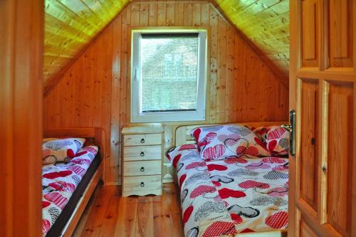 Ένα ή περισσότερα κρεβάτια σε δωμάτιο στο Holiday homes, Kolczewo