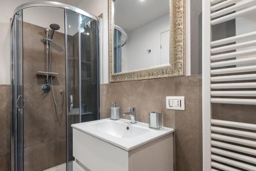 a bathroom with a sink and a shower at Florence Feel Apartment in Florence