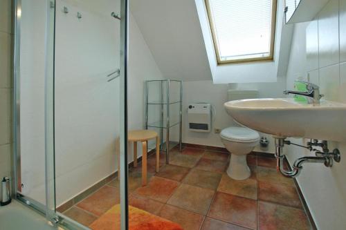 a bathroom with a toilet and a sink and a shower at Holiday resort in the Müritz National Park, Mirow in Mirow