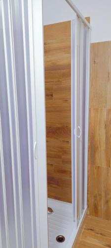 a white cabinet with a mirror in a room at Hypnos Sleep and Go in Benevento