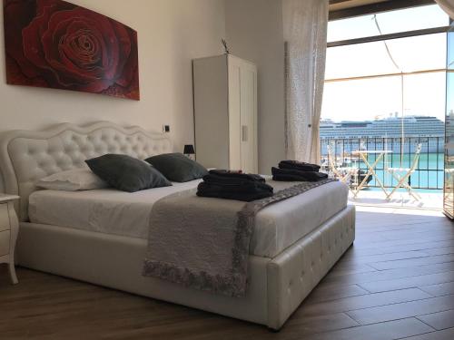 Ένα ή περισσότερα κρεβάτια σε δωμάτιο στο B&B Il Veliero