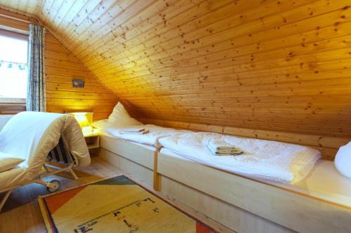 a room with two beds in a wooden cabin at Ferienhaus in Hasselfelde in Hasselfelde