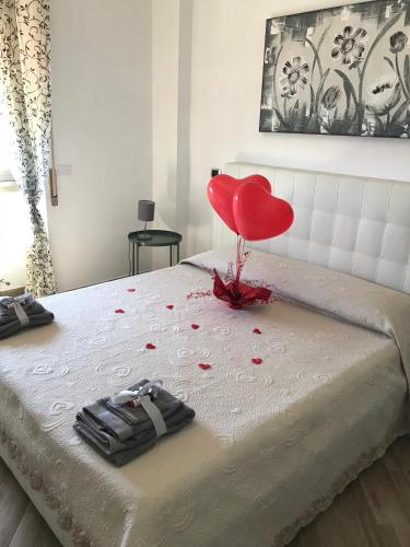 Ένα ή περισσότερα κρεβάτια σε δωμάτιο στο B&B Il Veliero
