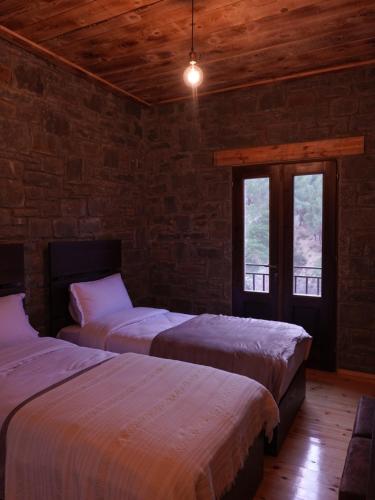 En eller flere senger på et rom på Chri Chri Guesthouse