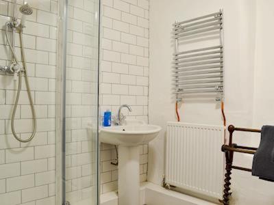 a white bathroom with a sink and a shower at Low House Farm North, Troutbeck, Windermere in Windermere