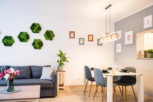 a living room with a couch and a table at BoRa Apartments in Villach