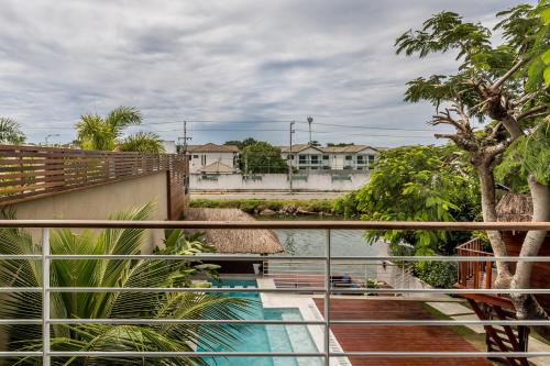 a balcony with a view of a body of water at Pousada Boutique do lazer in Cabo Frio