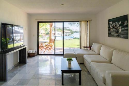 a living room with a couch and a table at Villas La Marina in Cancún