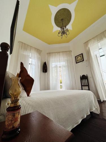 Postel nebo postele na pokoji v ubytování Ti Maria Guest House