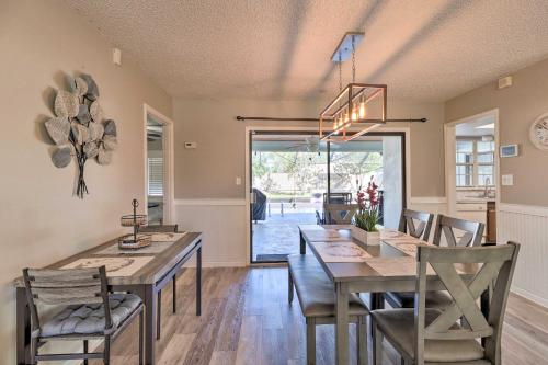 a dining room with a table and chairs at Modern Port St Lucie Home with Private Outdoor Oasis in River Park