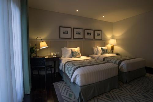 Katil atau katil-katil dalam bilik di The Shalimar Boutique Hotel