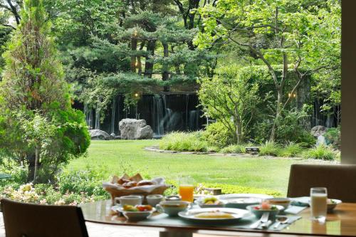 a table with food on it in a garden at Sapporo Park Hotel in Sapporo