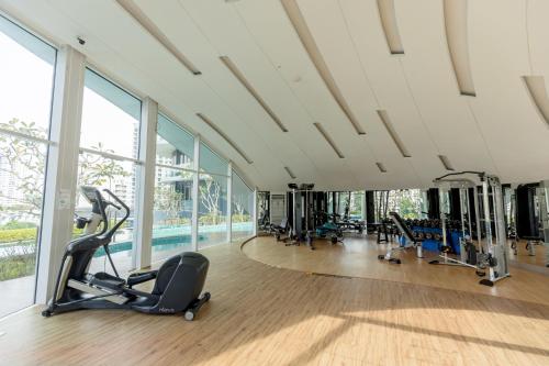 a gym with treadmills and ellipticals in a building at ArteS Suite Penang, by HOMEY in George Town