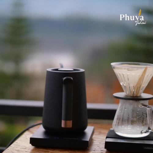 a black coffee maker sitting on top of a table at Phuyafahsai The Resort Khao Kho in Khao Kho