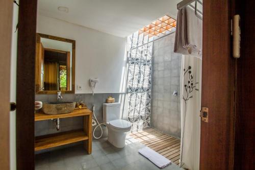 A bathroom at Pangkung Carik Villa by Pramana Villas