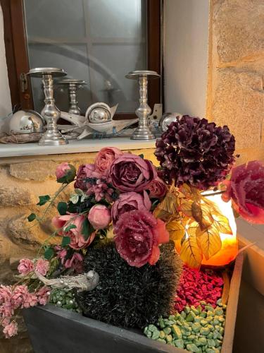 a bouquet of flowers in a box in front of a mirror at Sancta Katharina in Rozvadov