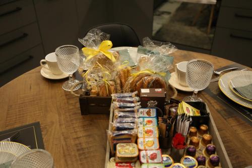 a table with a tray of food on a table at LA Larissa Luxury Apartments Kreousa in Larisa