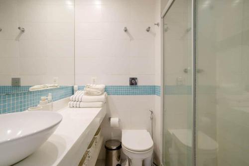 a bathroom with a sink and a toilet and a shower at LEBLON - TOP LOCATION - Serviced Apartment in Rio de Janeiro